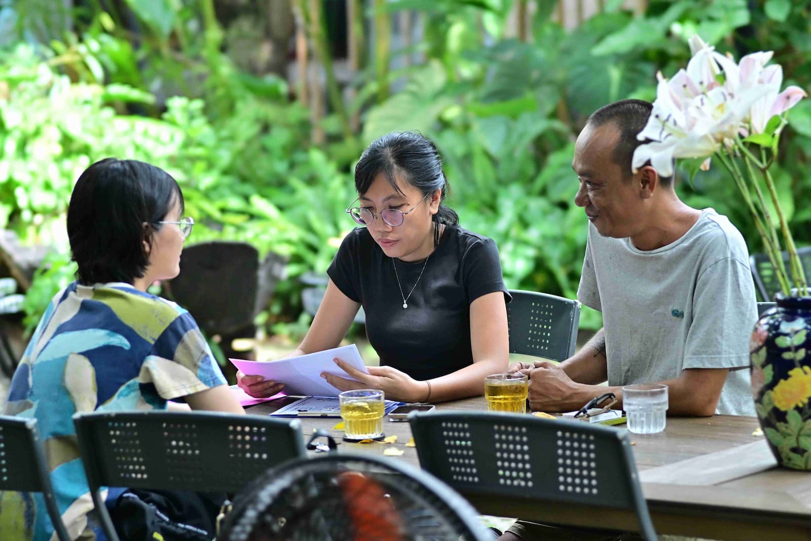 Coordinator discussing journey plans with clients